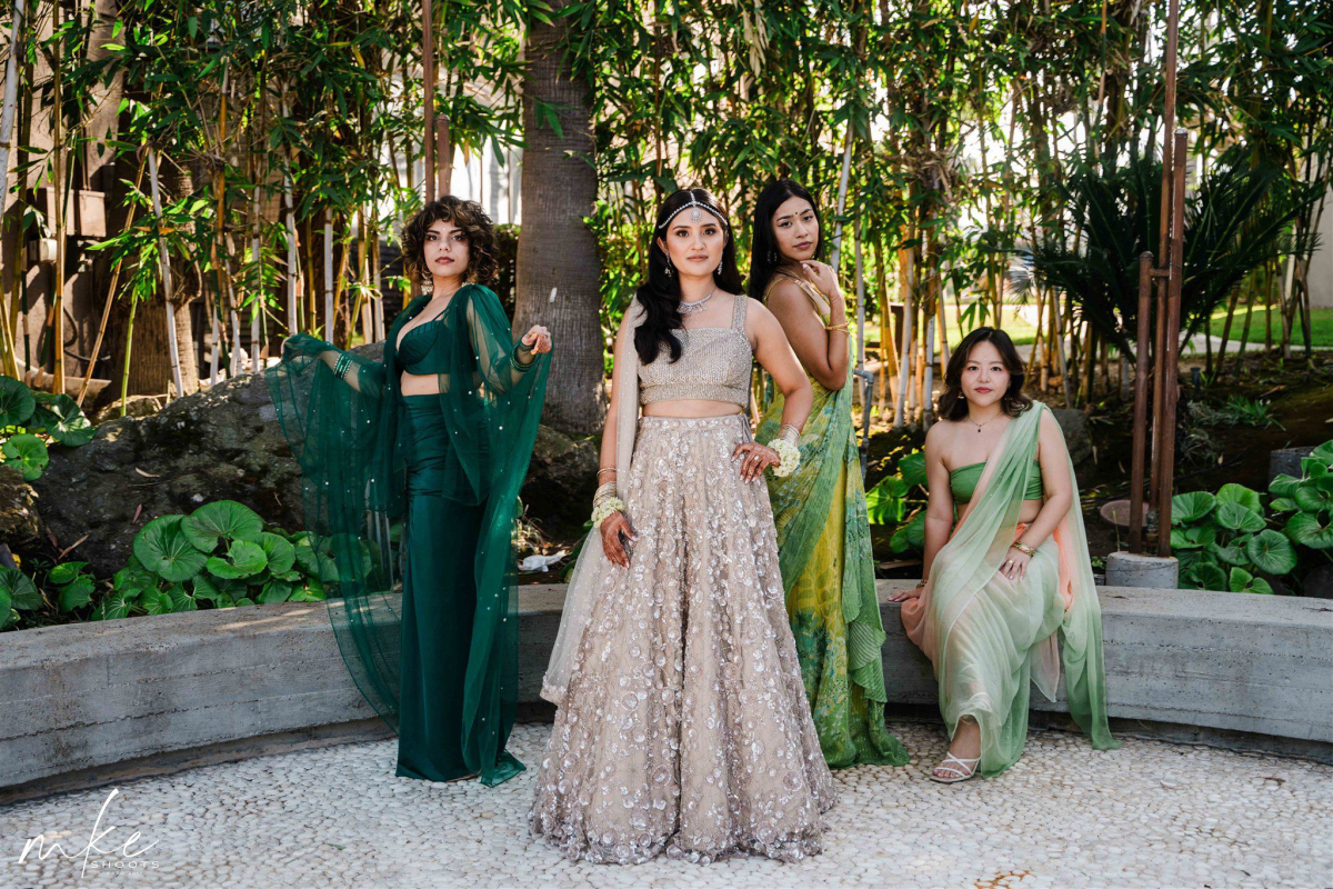 Bridesmaids striking sassy over-the-shoulder pose with playful expressions